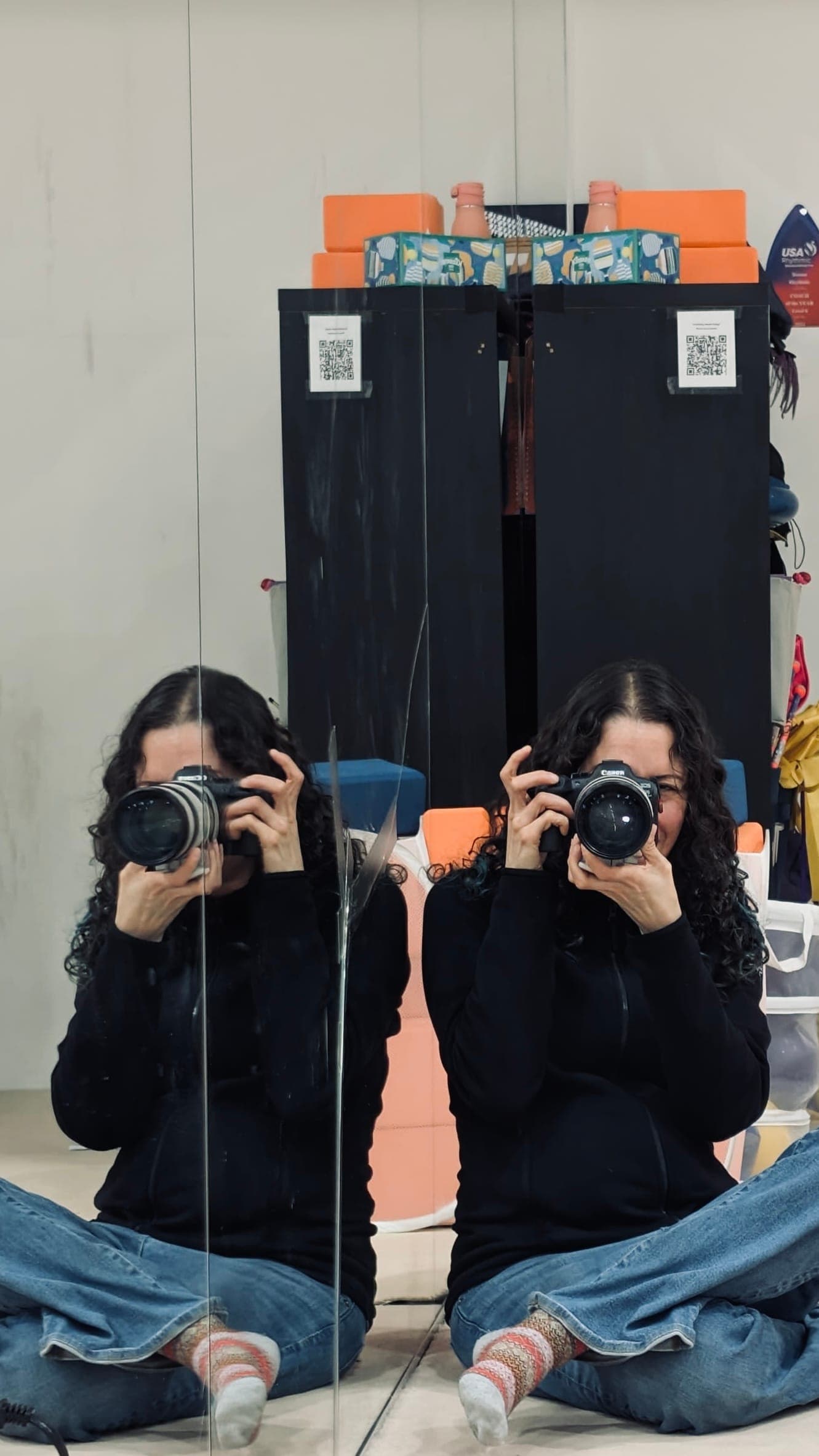 Monica Martin, owner of MonMartin Photography, holding her camera