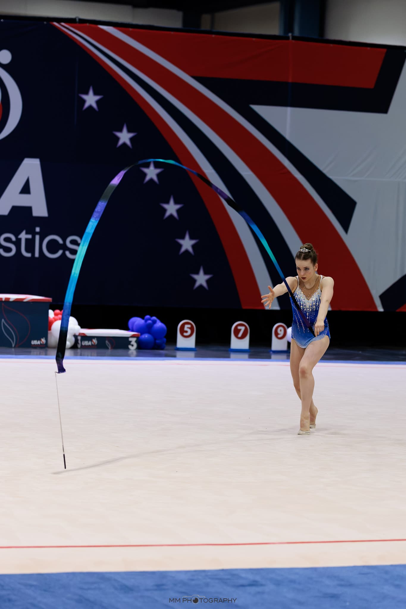 A gymnast performing a ribbon routine at a national competition